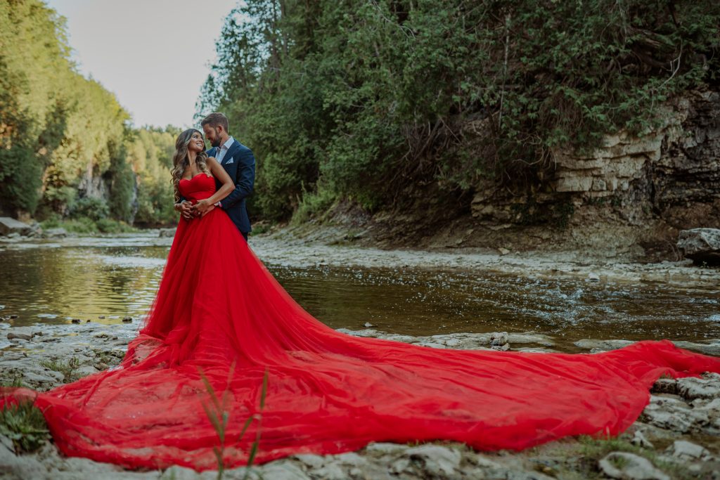 Engagement Photoshoot in a long red dress at Elora Gorge